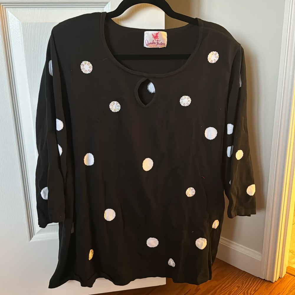 Black sweater with white polka dots